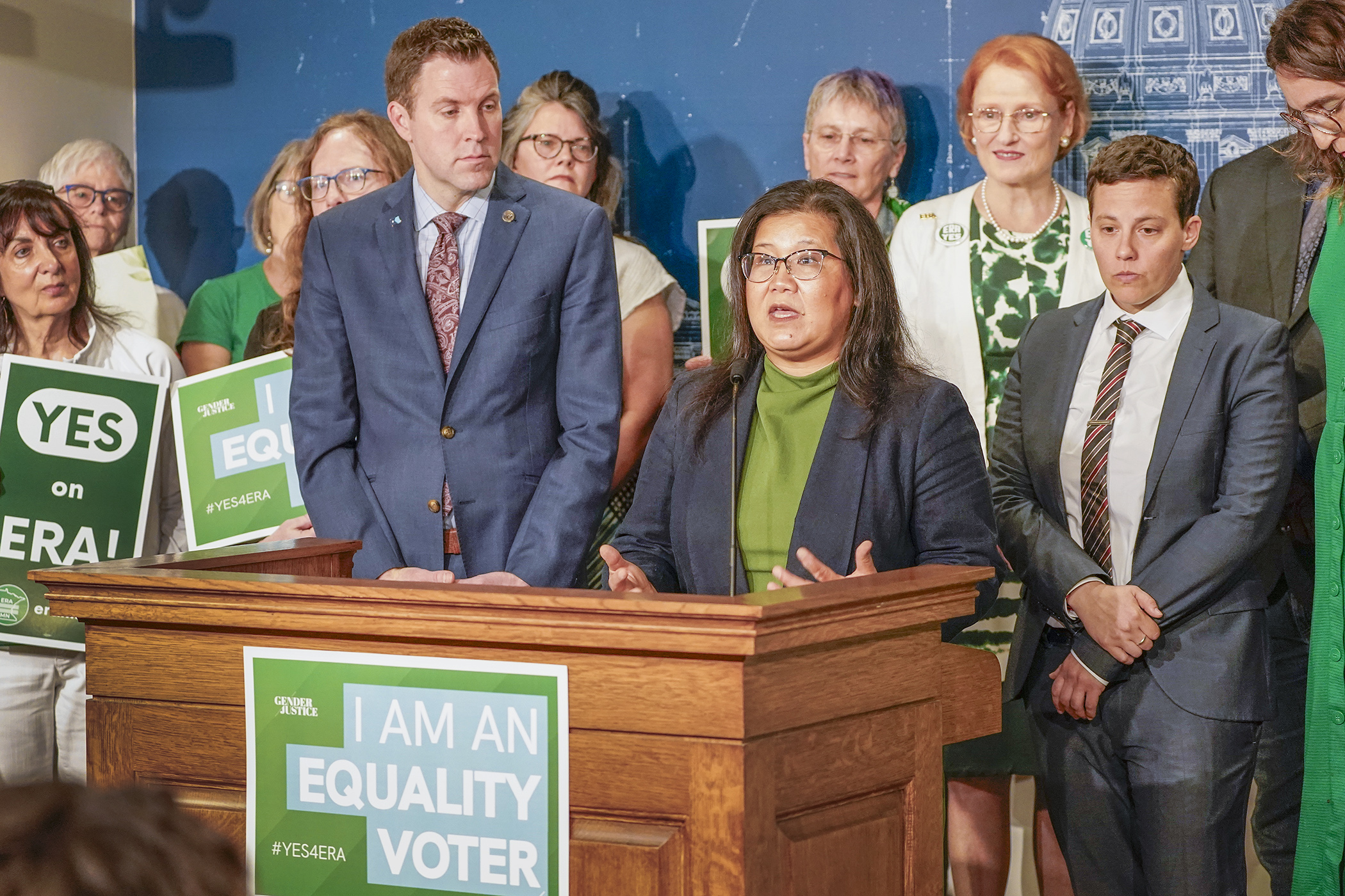 Surrounded by legislators and advocates, Rep. Kaohly Vang Her answers a question at a Monday news conference on a proposed Equal Rights Amendment to state voters in 2026. The House plans to vote on the bill before the day is done. (Photo by Andrew VonBank)